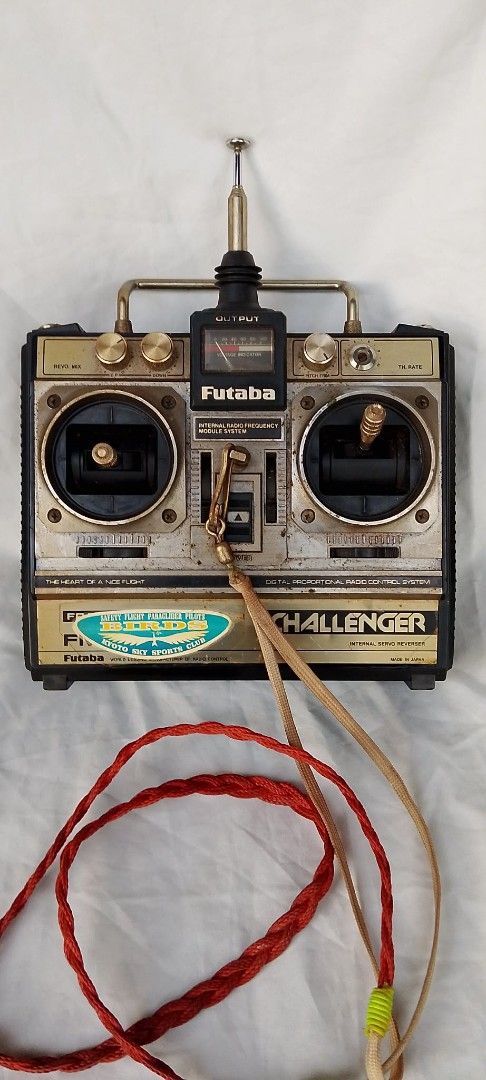 Futaba Challenger RC Radio Transmitter Controller (Category: Remote Control Toys) located in Quezon City. Submitted by jpnvintageonline (Listing ID 1466996627, Image 2). Description: - Vintage Futaba Challenger digital proportional radio control system - Ideal for hobbyists and collectors - Features metal control gimbals and rotary trim knobs - Built-in antenna and analog voltage indicator gauge - Includes original neck strap lanyard with clip - 