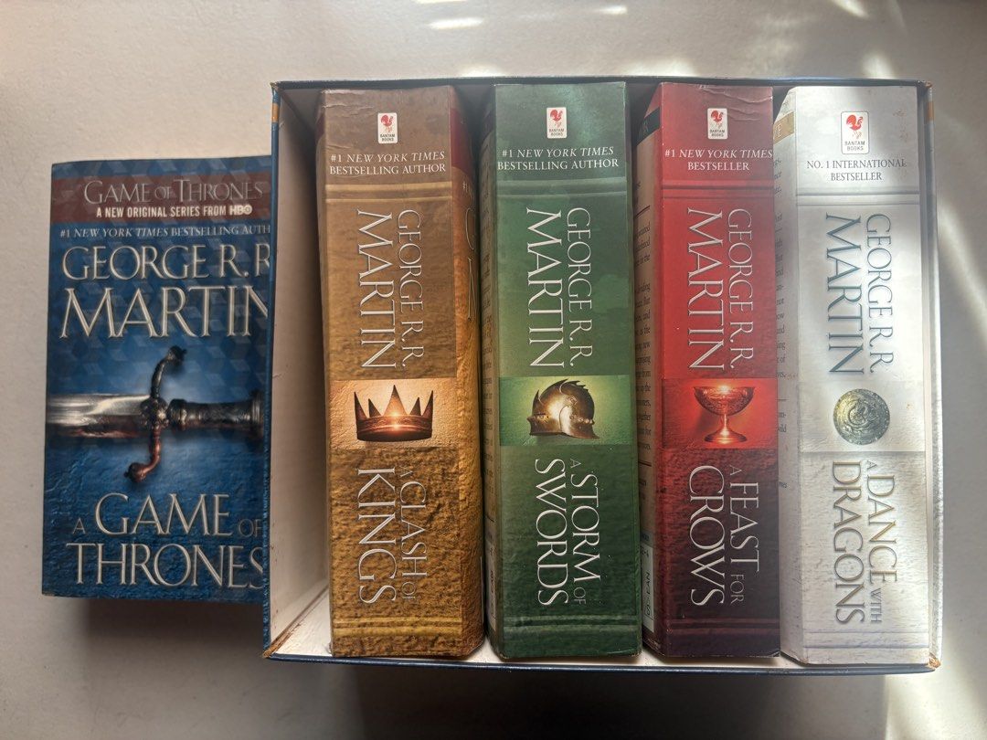 GAME OF THRONES WHOLE SET (Category: Storybooks) located in Davao. Submitted by flora7 (Listing ID 1467002306, Image 1). Description: - 1st book lang ang nalabas sa set, covered with a plastic patterned adhesive cover to secure, although nalabas hindi naman nabasa, it aged lang talaga because the bookshelf is exposed sa sun - the rest of the series never na nalabas never din nagamit/binasa so good as new sila - creases in the spine of the rest of