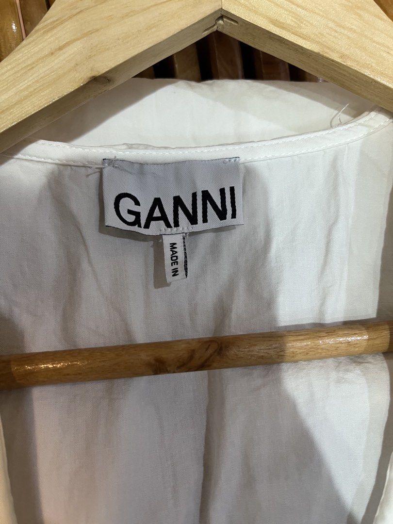 Ganni white ruffle collar button down blouse size 36 (Category: Blouses) located in Manila. Submitted by shanaaa.collects (Listing ID 1466973098, Image 2). Description: - Brand: Ganni - Size: 36 (fits S/M) - Color: White - Material: Crisp cotton - Details: Oversized ruffle collar, front button closure with metallic hardware, climate compensated clothing label - Condition: Great classic piece, easy to style for work or casual outings.
