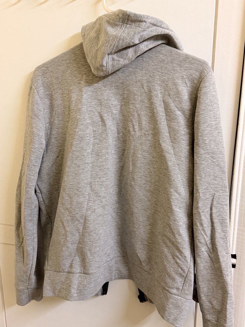GAP Heather Grey Full Zip Hoodie Size M (Category: Coats, Jackets and Outerwear) located in Manila. Submitted by lanzblade (Listing ID 1467063596, Image 3). Description: - Brand: Gap - Style: Full zip hoodie with attached hood - Color: Heather grey with contrasting black drawstrings - Size: Medium (Made in Vietnam) - Pockets: Two front hand pockets plus a stylish zippered front chest pocket - Details: Subtle Gap logo tag near the hem, ribbed cuff