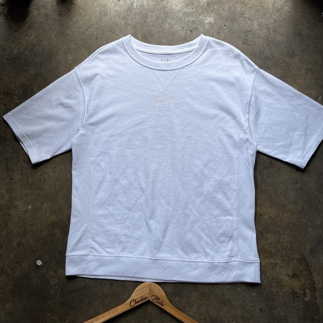 GAP White T-Shirt (Category: Tshirts & Polo Shirts ) located in Davao. Submitted by charlesole52665 (Listing ID 1467139572, Image 1). Description: - Brand: GAP - Color: White - Size: XS on tag oversize ( Fit up to L) - Width: 21 inch - Length: 26.5 inch - Style: Short sleeve crew neck with embroidered chest logo - Material: Soft and comfortable - Origin: Made in Indonesia - Condition: Clean, excellent, and ready to wear.