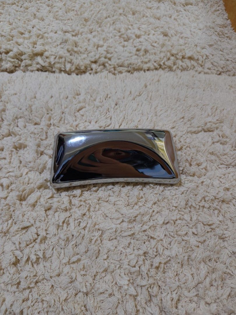 Gentle Monster glasses case (Category: Luxury Accessories) located in Baguio. Submitted by sky_alexander143 (Listing ID 1467028167, Image 2). Description: - Brand: Gentle Monster - Type: Glasses / Sunglasses Case - Exterior: Glossy metallic silver hard shell with a modern curved design - Interior: Soft light-blue velvet lining with embossed Gentle Monster branding - Condition: Well-maintained and ready to use - Ideal for safe storage and stylish 