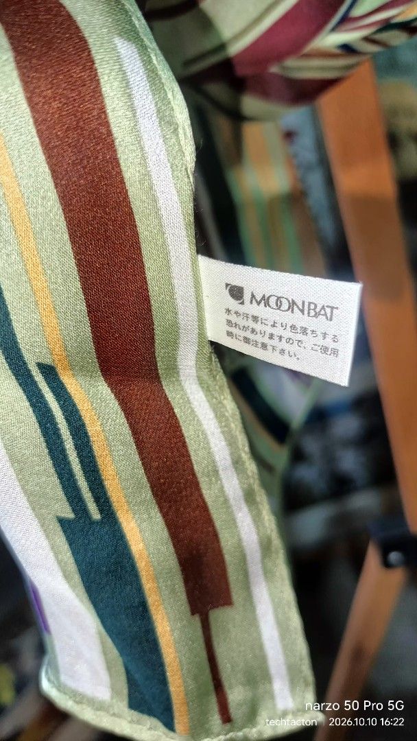 Givenchy by Moonbat Striped Pattern Silk Scarf (Category: Scarves) located in Santo Tomas. Submitted by pickers_corner (Listing ID 1467137844, Image 3). Description: - Brand:Givenchy by Moonbat - Design: Vertical stripes with abstract block pattern - Colors: Green, brown, blue, purple, and cream - Material: Soft fabric with a gorgeous drape - Condition: Great piece for cooler weather excellent condition no issue.