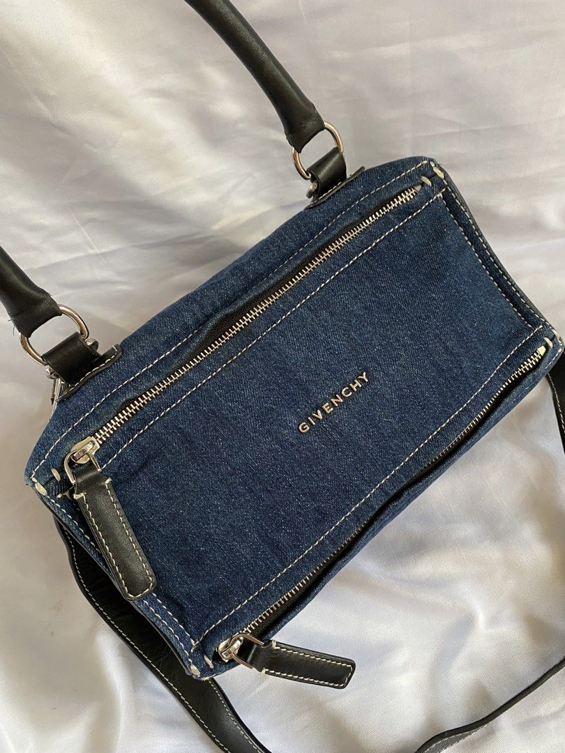 Givenchy Denim and Black Leather Handbag (Category: Cross-body Bags) located in Manila. Submitted by grandowl_5653cd (Listing ID 1467016280, Image 2). Description: - Brand: Givenchy - Material: Premium denim with black leather trim - Hardware: Silver-tone with secure top and side zipper closures - Handles/Strap: Double top handles plus a convenient detachable shoulder strap - Interior: Fabric lining featuring the official Givenchy leather tag, se