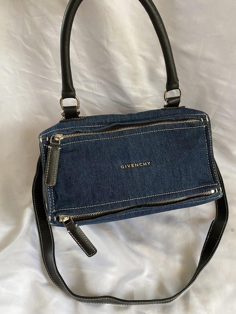 Givenchy Denim and Black Leather Handbag (Category: Cross-body Bags) located in Manila. Submitted by grandowl_5653cd (Listing ID 1467016280, Image 1). Description: - Brand: Givenchy - Material: Premium denim with black leather trim - Hardware: Silver-tone with secure top and side zipper closures - Handles/Strap: Double top handles plus a convenient detachable shoulder strap - Interior: Fabric lining featuring the official Givenchy leather tag, se