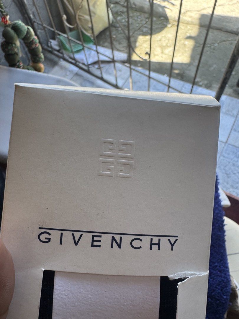 Givenchy mat and socks same brand new (Category: Socks) located in Sual. Submitted by wakusurplus07031121 (Listing ID 1466986184, Image 3). Description: - Brand: Monsieur Givenchy - Color: Classic Black - Style: Mid-calf dress socks with ankle logo - Material: Premium wool, polyester, and nylon blend - Condition: Brand new with original paper band - Packaging: Comes in original branded Givenchy box.