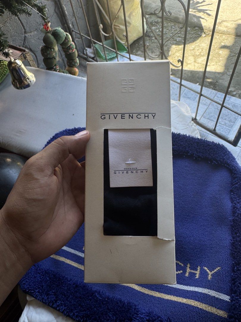 Givenchy mat and socks same brand new (Category: Socks) located in Sual. Submitted by wakusurplus07031121 (Listing ID 1466986184, Image 2). Description: - Brand: Monsieur Givenchy - Color: Classic Black - Style: Mid-calf dress socks with ankle logo - Material: Premium wool, polyester, and nylon blend - Condition: Brand new with original paper band - Packaging: Comes in original branded Givenchy box.
