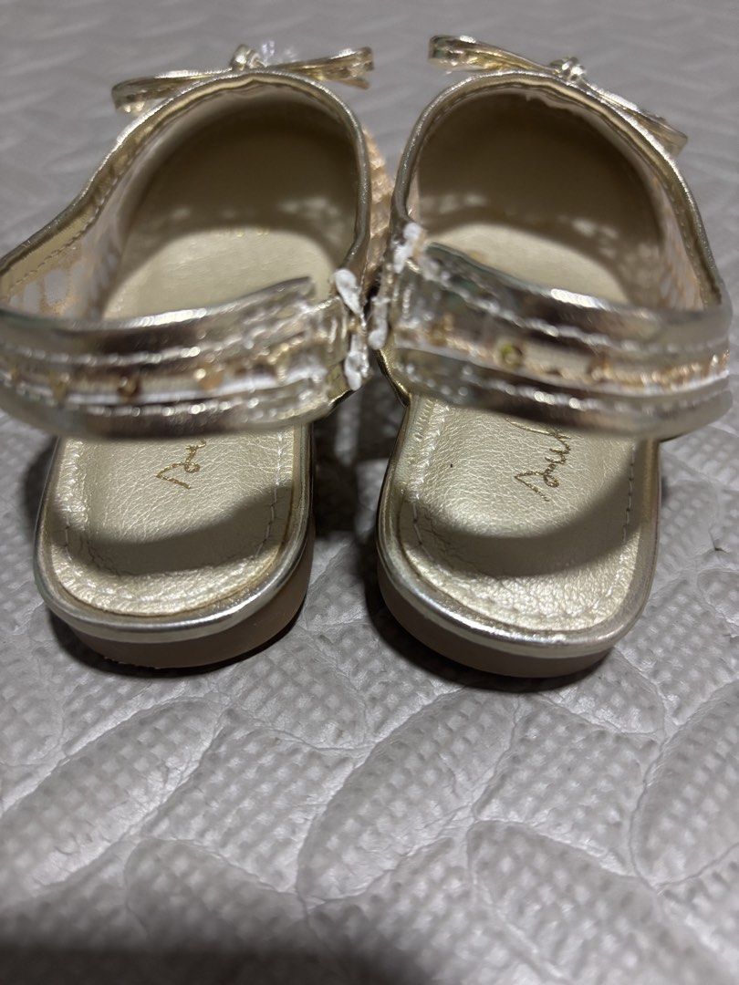 Gold mesh sequin toddler flats size 24 (Category: Babies & Kids Fashion) located in Pasig City. Submitted by johndarell47046 (Listing ID 1467139842, Image 2). Description: - Color/Design: Dazzling gold sparkly flats with mesh upper covered in tiny sequins and an adorable bow on the toe box - Comfort & Fit: Slingback strap with elastic stretch for easy wear, plus a gold metallic cushioned footbed - Size: EUR 24 (stamped on the brown rubber outsole