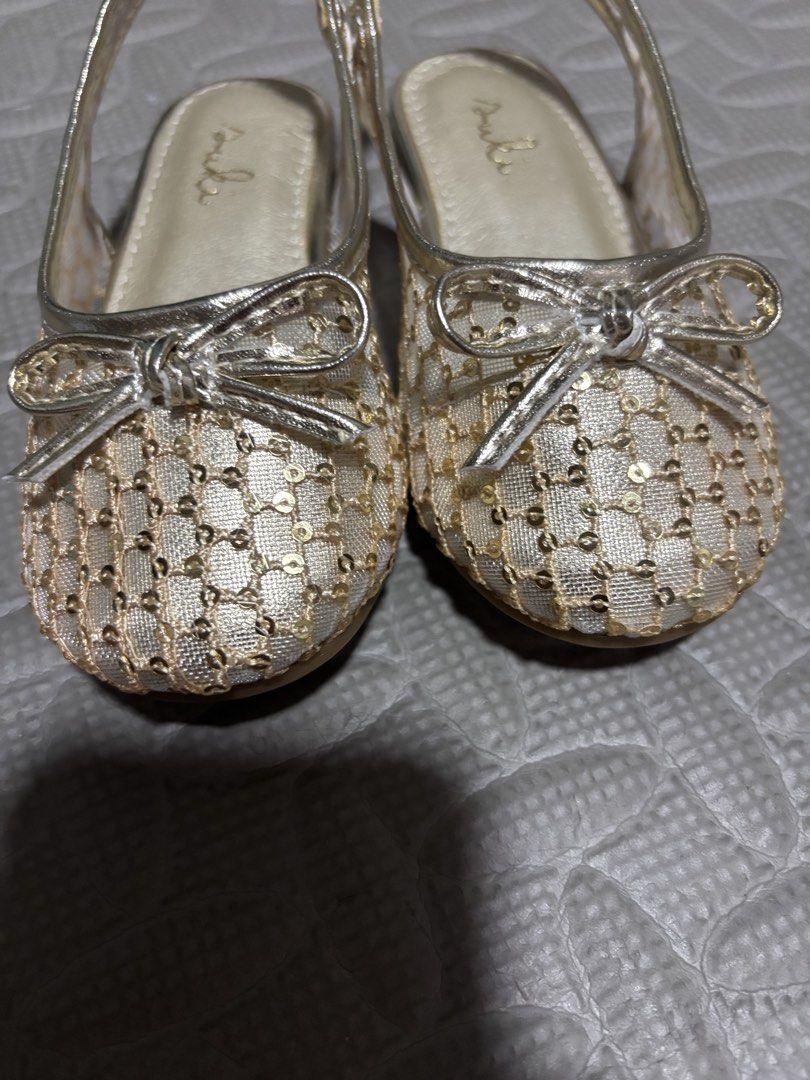 Gold mesh sequin toddler flats size 24 (Category: Babies & Kids Fashion) located in Pasig City. Submitted by johndarell47046 (Listing ID 1467139842, Image 3). Description: - Color/Design: Dazzling gold sparkly flats with mesh upper covered in tiny sequins and an adorable bow on the toe box - Comfort & Fit: Slingback strap with elastic stretch for easy wear, plus a gold metallic cushioned footbed - Size: EUR 24 (stamped on the brown rubber outsole