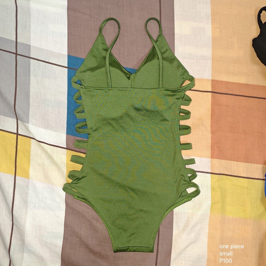 Green One-Piece Swimsuit Small Cutout Sides (Category: Bikinis & Swimsuits) located in Manila. Submitted by emailmeonj79332 (Listing ID 1467155339, Image 1). Description: - Color: Green - Size: Small (S) - Design: V-neck with thin shoulder straps and trendy side cutouts - Material: Smooth and stretchy fabric for maximum comfort - Ideal for: Beach trips, pool parties, and vacations - Condition: Brand new / Excellent quality.