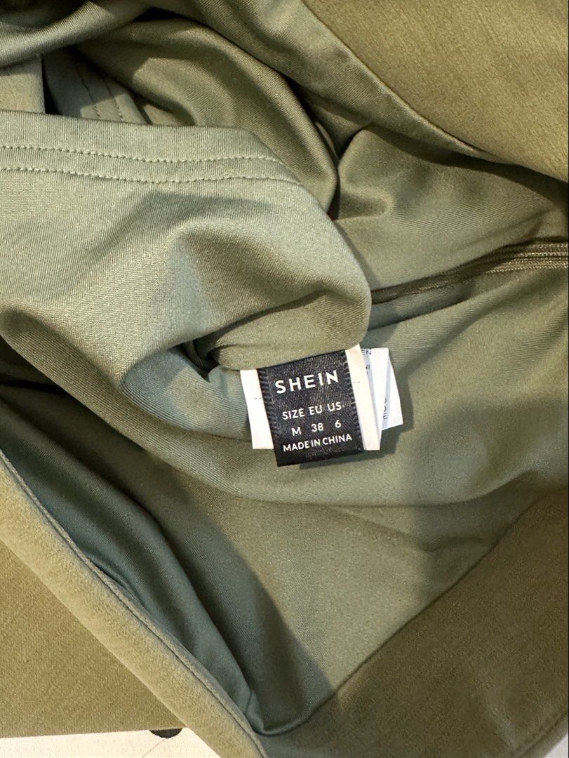 Green Skort with White String Tie Size M (Category: Skirts) located in San Pedro. Submitted by sweetcosmics (Listing ID 1467072861, Image 3). Description: - Brand: SHEIN - Color: Green - Size: M / EU 38 / US 6 - Design: Built-in shorts underneath, decorative white string tie at the front, side zip closure.