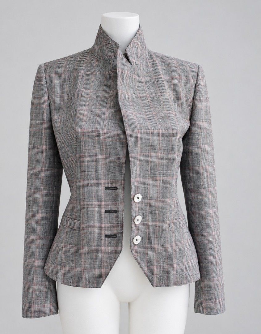 Grey Glen Plaid Mandarin Collar Blazer Jacket (Category: Coats, Jackets and Outerwear) located in Cebu City. Submitted by kitty032110 (Listing ID 1466988435, Image 1). Description: - Design: Grey and pink glen plaid pattern with a mandarin style high collar - Closure: Asymmetric front opening with white buttons and contrast dark buttonholes - Fit: Structured shoulders, fitted waist, and flared hem for a tailored silhouette - Details: Two small fl