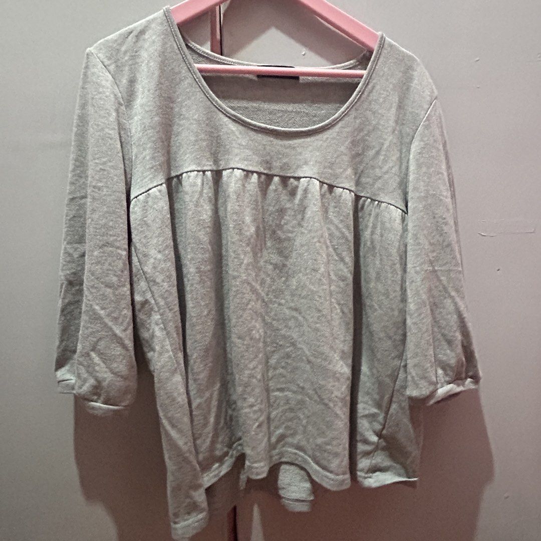 Grey Long Sleeve Scoop Neck Blouse (Category: Longsleeves) located in Mandaluyong City. Submitted by strawbyeries (Listing ID 1467145298, Image 1). Description: - Color: Versatile grey - Material: Soft, breathable cotton - Sleeves: Three-quarter length - Neckline: Flattering scoop neck - Design: Gathered panel across the chest, relaxed fit, slightly longer back hem - Style: Great for casual everyday wear, easily pairs with jeans or skirts.