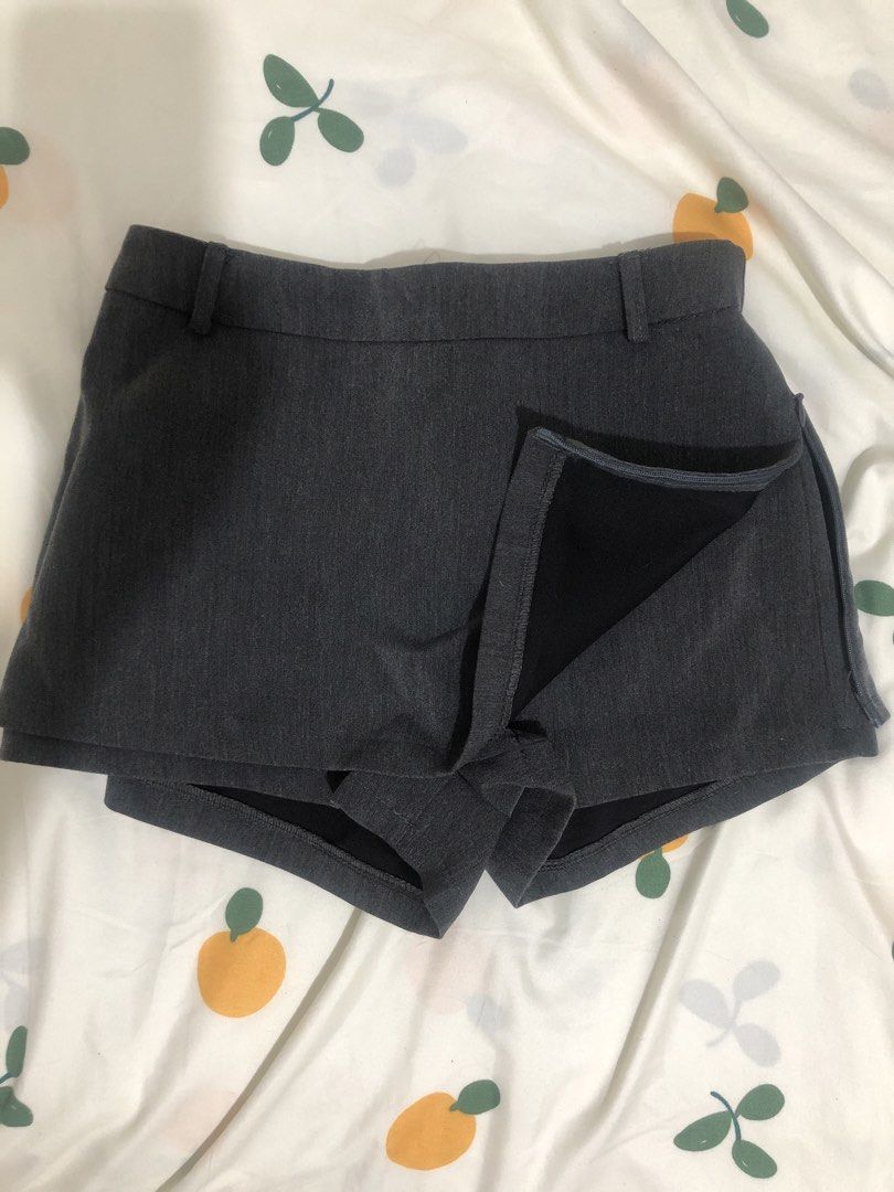 Grey Skort with Built-In Shorts (Category: Skirts) located in Quezon City. Submitted by maggie.styles (Listing ID 1467129889, Image 2). Description: - Color: Grey - Style: High-waist skort with front skirt overlay and built-in shorts - Closure: Side zipper - Details: Belt loops and two back faux welt pockets.