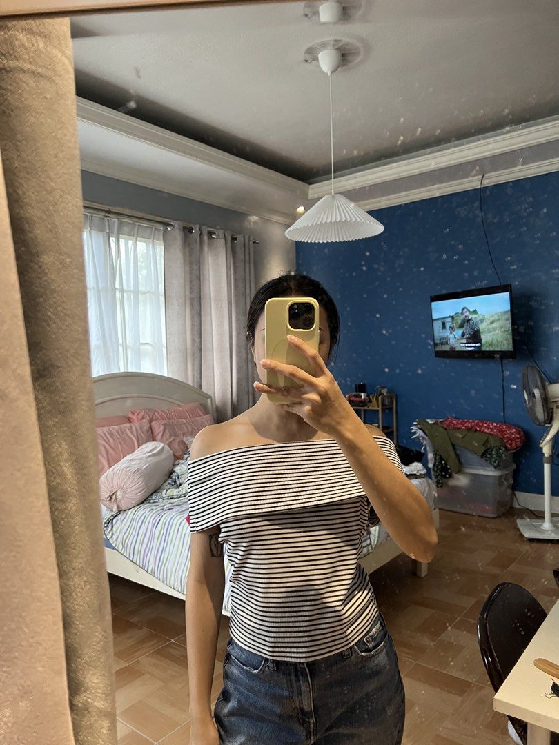 GU Black and White Striped Off-Shoulder Top (Category: Blouses) located in Bulacan. Submitted by fallongallon (Listing ID 1467044214, Image 1). Description: - Design: Black and white striped off-shoulder top with a trendy foldover neckline - Material: Soft, stretchy ribbed knit fabric for all-day comfort - Sleeves: Standard short sleeves - Styling: Perfect match for high-waisted denim jeans - Condition: Clean and well-maintained.