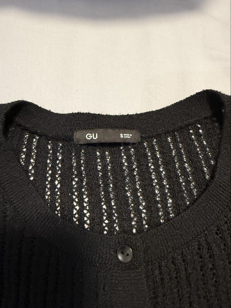 GU Black Open Knit Cardigan (Category: Coats, Jackets and Outerwear) located in Dasmarinas. Submitted by denmae (Listing ID 1466987823, Image 3). Description: - Brand/Model: GU black cardigan - Material: Lightweight open-knit mesh (slightly sheer) - Design: Long sleeves, round neckline, button-down front - Style: Minimalist basic, great for layering I still love this but won’t fit my postpartum body anymore 😢.