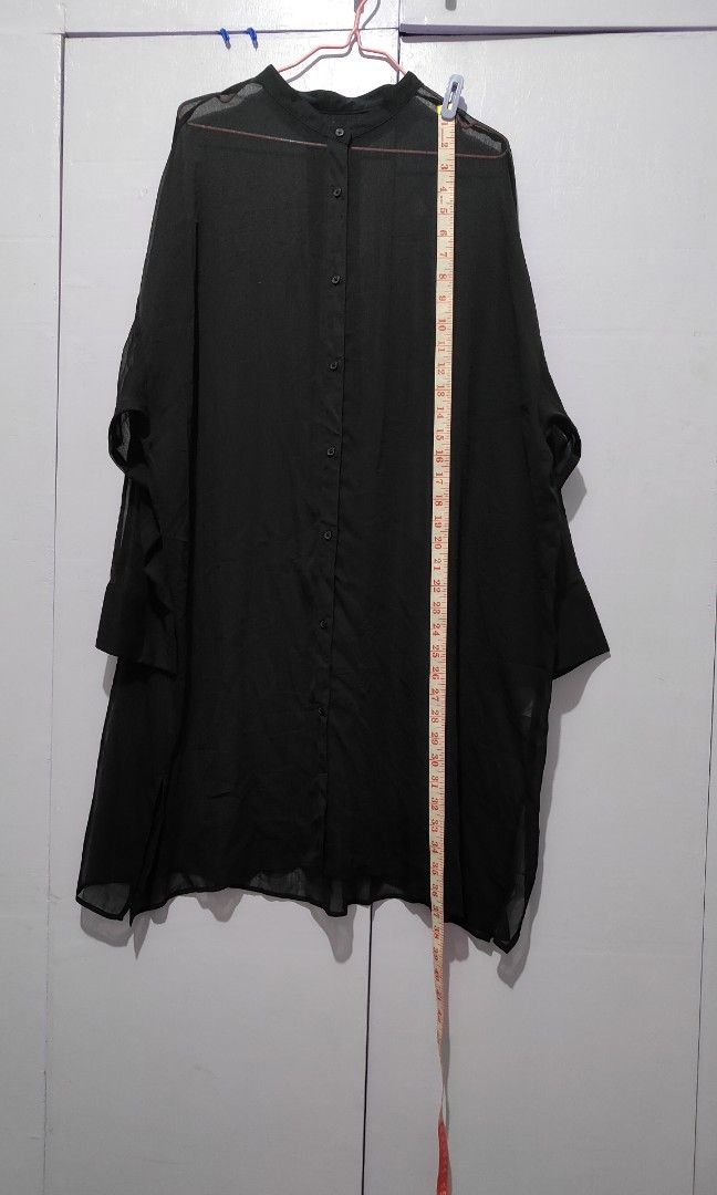 GU Black sheer button down tunic oversized long sleeve shirt (Category: Longsleeves) located in Bacolor. Submitted by annjjjjj (Listing ID 1467105262, Image 3). Description: - Color: Black - Style: Sheer button-down shirt with mandarin collar and long tunic length - Fit: Oversized, relaxed, and lightweight - Sleeves: Long sleeves with cuffs - Versatility: Perfect for layering over tops or dresses, easily styled up or down.