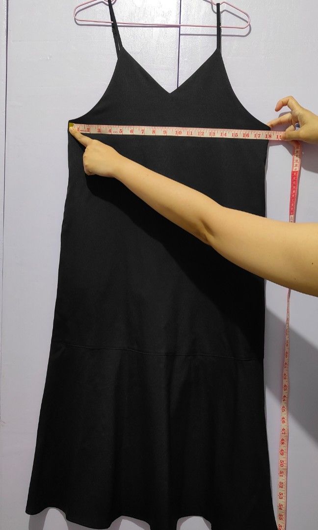 GU Black Spaghetti Strap Midi Dress V-Neck (Category: Dresses) located in Bacolor. Submitted by annjjjjj (Listing ID 1467104757, Image 2). Description: - Color: Classic Black - Style: Midi length with a sleek straight cut - Details: V-neckline, thin spaghetti straps, and a stylish paneled seam near the hem - Fabric: Smooth finish, comfortable and lightweight - Versatility: Easy to dress up with heels or keep casual with sneakers - Condition: Exce