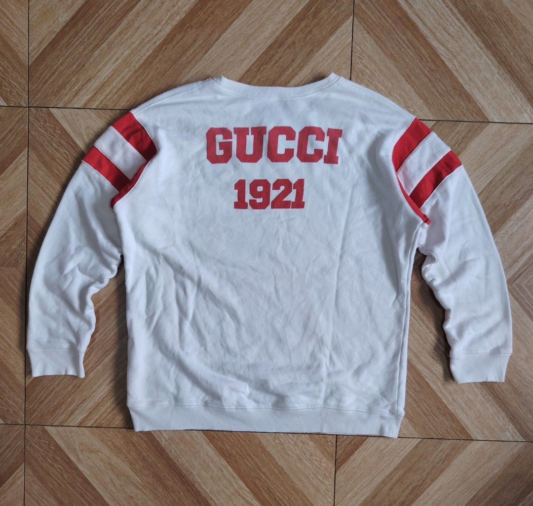 GUCCI 100th Anniversary Sweatshirt (Category: Tshirts & Polo Shirts ) located in Marikina City. Submitted by kingdrel (Listing ID 1466988985, Image 2). Description: GUCCI 100th Anniversary Sweatshirt W 23 L 26.5 GOOG CONDITION NEED WASH.