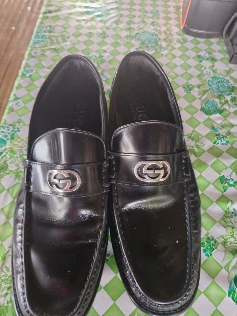 Gucci Black Leather Interlocking G Loafers (Category: Loafers) located in Dipolog. Submitted by silverocean-c236 (Listing ID 1467130237, Image 2). Description: - Brand: Gucci - Color: Black - Material: Genuine Leather - Hardware: Silver Interlocking G - Origin: Made in Italy - Style: Slip-on penny loafer, ideal for formal and business casual wear - Condition: Shows normal wear on soles and insoles.