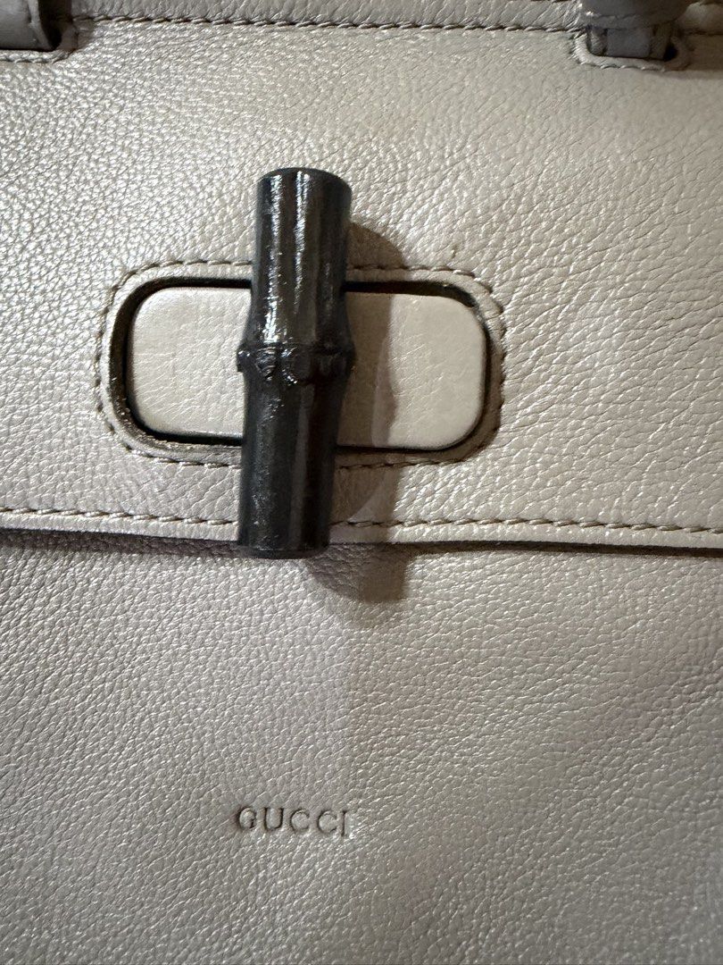Authentic Gucci Grey Leather Bamboo Top Handle Bag (Category: Luxury Bags & Wallets) located in Manila. Submitted by lynnalec25 (Listing ID 1467146214, Image 2). Description: - Brand: Gucci - Material: Premium grey pebbled leather with silver-toned hardware - Closure: Signature bamboo turn-lock on front flap - Straps: Dual top handles and a detachable, adjustable shoulder strap - Design: Structured silhouette, clean stitching, and debossed Gucci 
