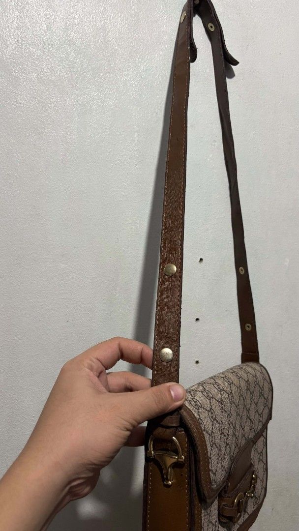 Gucci Monogram Horsebit Shoulder Bag (Category: Luxury Bags & Wallets) located in Manila. Submitted by alenoid (Listing ID 1467140301, Image 3). Description: - Gucci shoulder bag in beige/brown monogram canvas - Classic gold-tone horsebit hardware on front flap - Adjustable brown leather strap with metal snap buttons - Clean fabric lining with interior zip pocket and QR code tag - Spacious enough for daily essentials - Condition: Good, well-maint