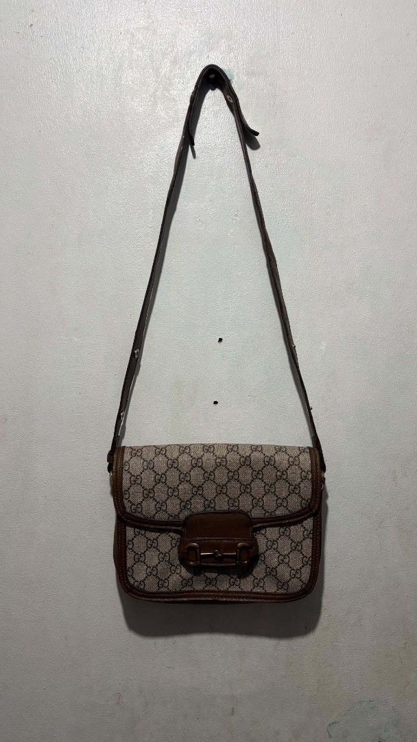 Gucci Monogram Horsebit Shoulder Bag (Category: Luxury Bags & Wallets) located in Manila. Submitted by alenoid (Listing ID 1467140301, Image 1). Description: - Gucci shoulder bag in beige/brown monogram canvas - Classic gold-tone horsebit hardware on front flap - Adjustable brown leather strap with metal snap buttons - Clean fabric lining with interior zip pocket and QR code tag - Spacious enough for daily essentials - Condition: Good, well-maint