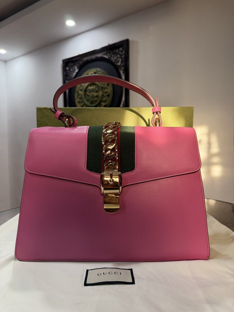 Gucci Pink Sylvie Medium Top Handle Shoulder Bag (Category: Luxury Bags & Wallets) located in Ilagan. Submitted by stargirldotph (Listing ID 1467098554, Image 1). Description: • ₱45,459 ONLY • Retail Price: $2,496 • Guaranteed Authentic • USED, but still very presentable, and ready to use. In excellent condition. • No major issues to mention. Please inspect all the photos. • Inclusions: Box, Dustbag • PM me for more inquiries WHAT YOU SEE IS WHAT