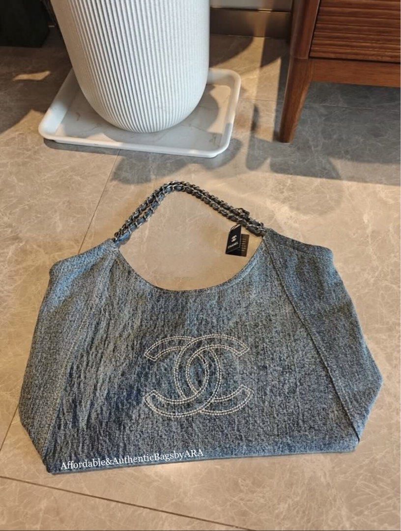 GWP CHANEL LIGHT WASHED DENIM TOTE (Category: Shoulder Bags) located in Daet. Submitted by ecassenluxuries (Listing ID 1467089984, Image 2). Description: 📌 FIXED PRICE ALREADY ✅ All items are guaranteed 💯% AUTHENTIC GWP ITEM ▫️Brand: Chanel ▫️Style: Light wash denim hobo bag ▫️Details: Large white stitched interlocking CC logo on the front ▫️Strap: Intertwined chain and denim shoulder strap with tag attached ▫️Design: Soft, slouchy structured b