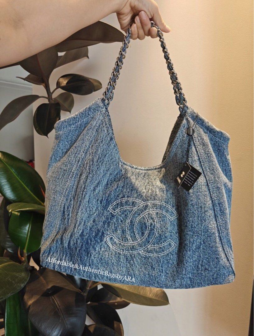 GWP CHANEL LIGHT WASHED DENIM TOTE (Category: Shoulder Bags) located in Daet. Submitted by ecassenluxuries (Listing ID 1467089984, Image 1). Description: 📌 FIXED PRICE ALREADY ✅ All items are guaranteed 💯% AUTHENTIC GWP ITEM ▫️Brand: Chanel ▫️Style: Light wash denim hobo bag ▫️Details: Large white stitched interlocking CC logo on the front ▫️Strap: Intertwined chain and denim shoulder strap with tag attached ▫️Design: Soft, slouchy structured b
