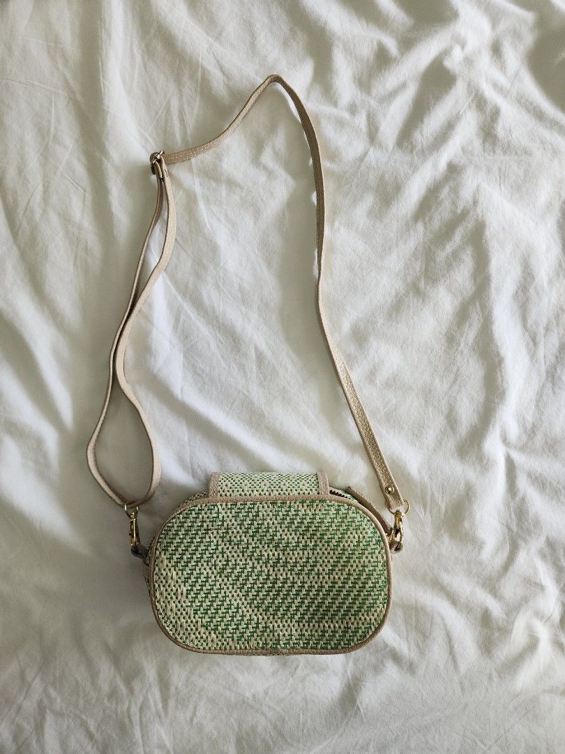 Halohalo Green Mini Lakwatsa Bag (Category: Cross-body Bags) located in Taguig. Submitted by groovefunknsoul (Listing ID 1467049734, Image 2). Description: - Brand: Halo Halo - Style: Green and cream woven oval crossbody bag - Closure: Zipper top main compartment with flap magnetic closure - Strap: Adjustable - Condition: Good overall, but has a few small red stains on the inner flap connector fabric (shown in 3rd photo) - Perfect cute summer acc