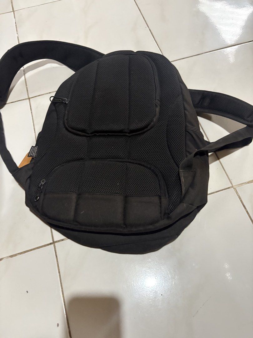 Hawk Black Backpack (Category: Backpacks) located in Manila. Submitted by gentlecloud_71412b (Listing ID 1467166352, Image 2). Description: - Brand: Hawk - Color: Classic black canvas - Storage: Multiple zippered front compartments for easy organization - Comfort: Padded mesh back panel and adjustable padded shoulder straps - Condition: Shows normal signs of dust and regular usage on the exterior - Ideal use: Perfect for school, work, or daily co