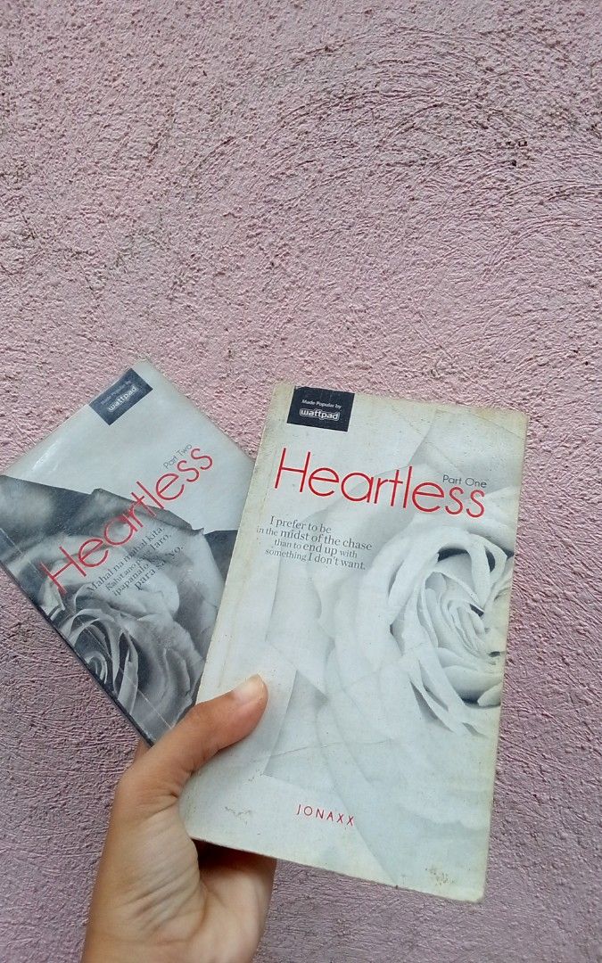 Heartless Part One and Part Two by Jonaxx (Category: Storybooks) located in Placer. Submitted by whimsythrifts (Listing ID 1467061562, Image 1). Description: - Title: Heartless (Part One and Part Two) - Author: Jonaxx (Popular Wattpad hit) - Format: Paperback bundle (White and grey rose cover designs) - Condition: Reading copies with visible signs of handling on covers and edges - Set: Complete set (Parts 1 and 2).