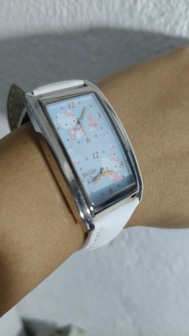 Hello Kitty Dial Dual Time Silver tone Rectangle White Ladies Strap (Category: Women's Watches) located in Taguig. Submitted by mercyeugen28914 (Listing ID 1467025846, Image 1). Description: Preloved Japan Watch hello Kitty Dial Dual Time Silver tone rectangular shape white Strap stainless steel back .