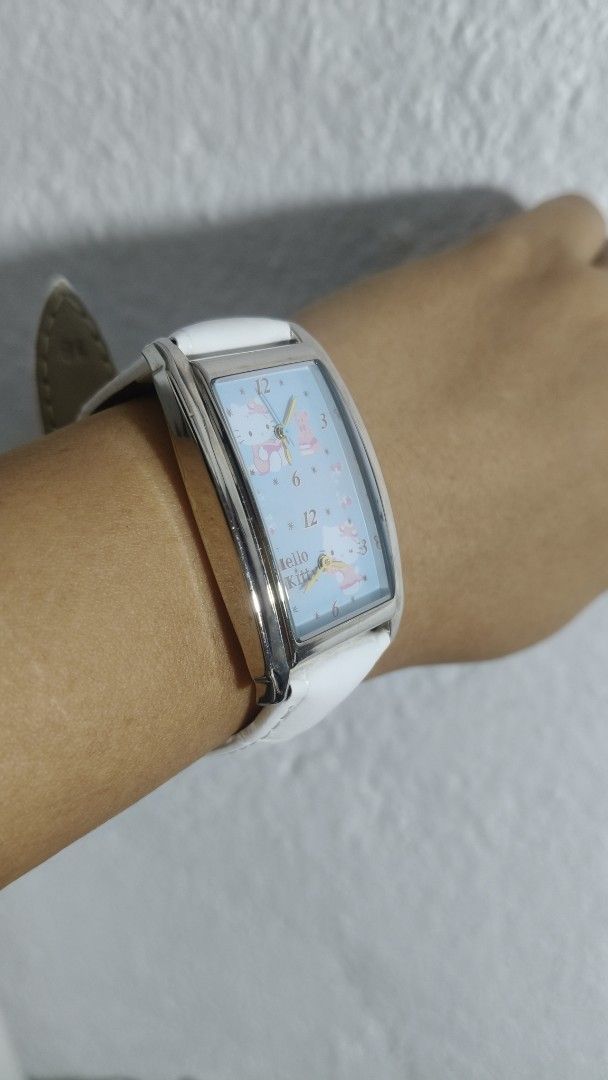 Hello Kitty Dial Dual Time Silver tone Rectangle White Ladies Strap (Category: Women's Watches) located in Taguig. Submitted by mercyeugen28914 (Listing ID 1467025846, Image 3). Description: Preloved Japan Watch hello Kitty Dial Dual Time Silver tone rectangular shape white Strap stainless steel back .