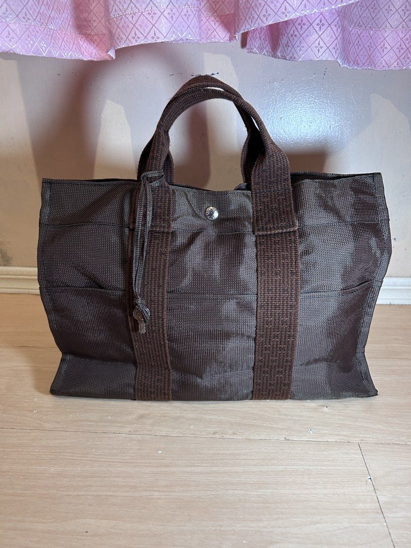 Hermes Herline MM handbag Bag Brown (Category: Luxury Bags & Wallets) located in Dipolog. Submitted by adrian281994 (Listing ID 1467077590, Image 1). Description: - Authentic Hermes herline MM brown tote bag - rich chocolate brown shade - Dual sturdy top handles with contrasting woven texture - Convenient open front pocket structure - Secure central snap button closure with branding stamp - Spacious interior ideal for daily essentials, commutes, 