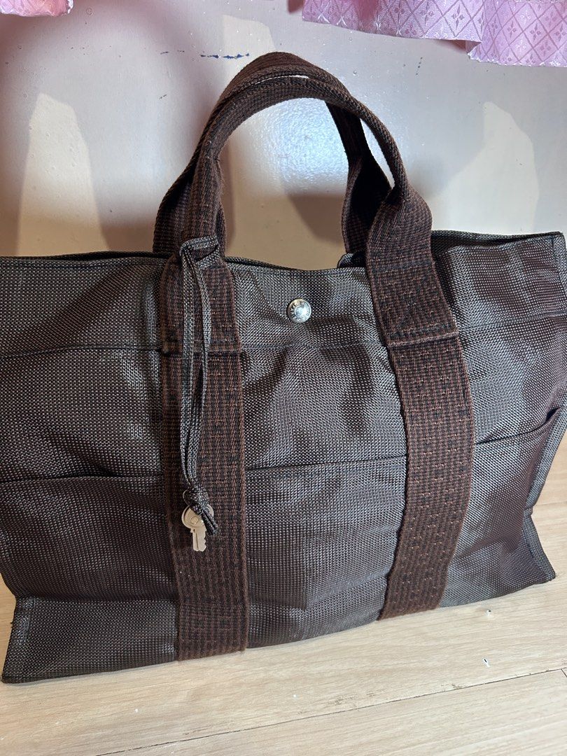 Hermes Herline MM handbag Bag Brown (Category: Luxury Bags & Wallets) located in Dipolog. Submitted by adrian281994 (Listing ID 1467077590, Image 3). Description: - Authentic Hermes herline MM brown tote bag - rich chocolate brown shade - Dual sturdy top handles with contrasting woven texture - Convenient open front pocket structure - Secure central snap button closure with branding stamp - Spacious interior ideal for daily essentials, commutes, 