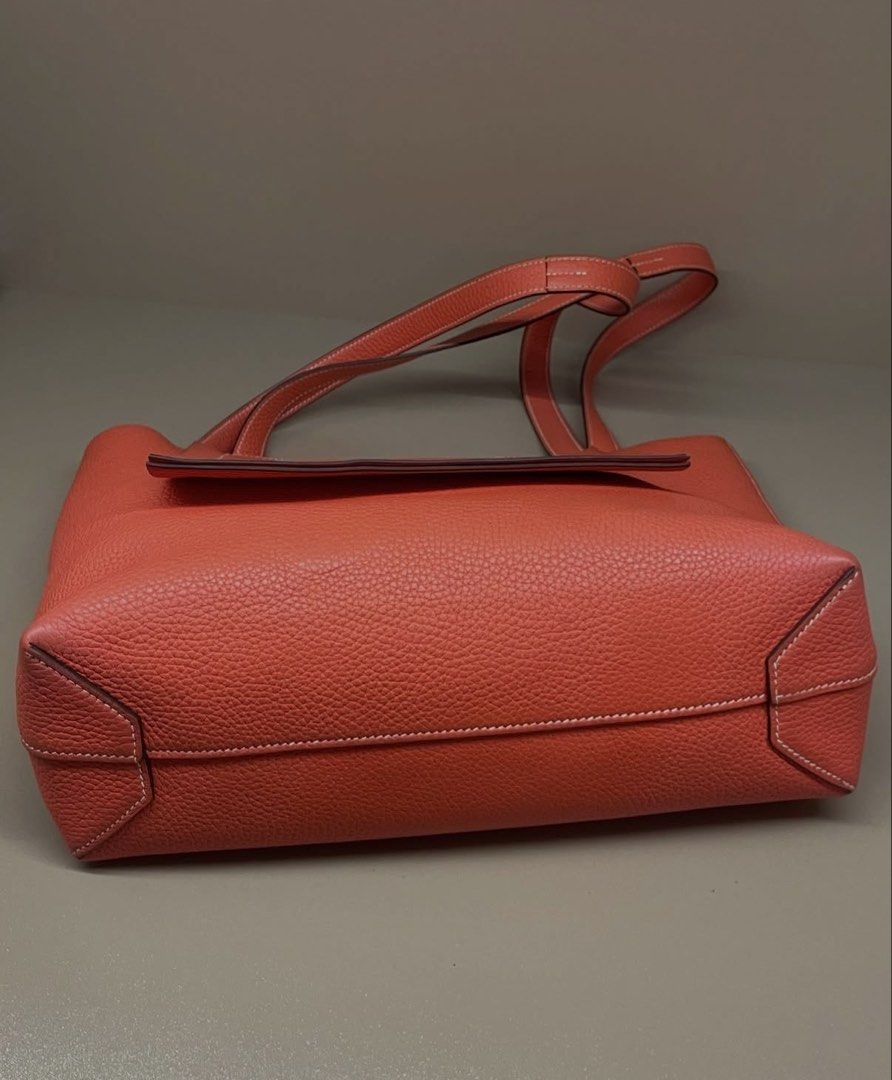 Hermès Cabasellier 31 (Category: Tote Bags) located in Makati City. Submitted by dgcurated09 (Listing ID 1467147443, Image 3). Description: - Authentic Hermès tote bag in vibrant orange pebbled leather - Open top design with comfortable dual shoulder straps - Luxurious unlined suede interior in a matching orange tone - Structured base with reinforced stitched corners for durability - Impeccable condition with zero scuffs or scratches - Sleek hard