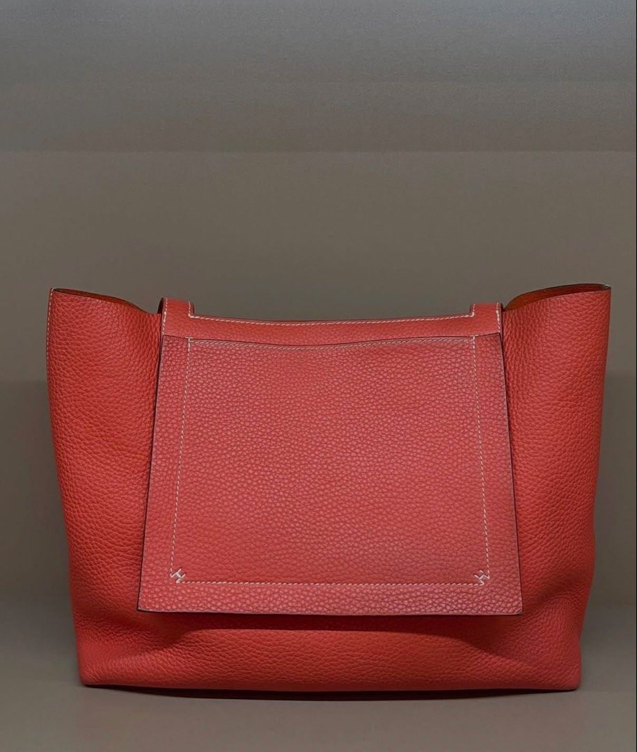 Hermès Cabasellier 31 (Category: Tote Bags) located in Makati City. Submitted by dgcurated09 (Listing ID 1467147443, Image 1). Description: - Authentic Hermès tote bag in vibrant orange pebbled leather - Open top design with comfortable dual shoulder straps - Luxurious unlined suede interior in a matching orange tone - Structured base with reinforced stitched corners for durability - Impeccable condition with zero scuffs or scratches - Sleek hard