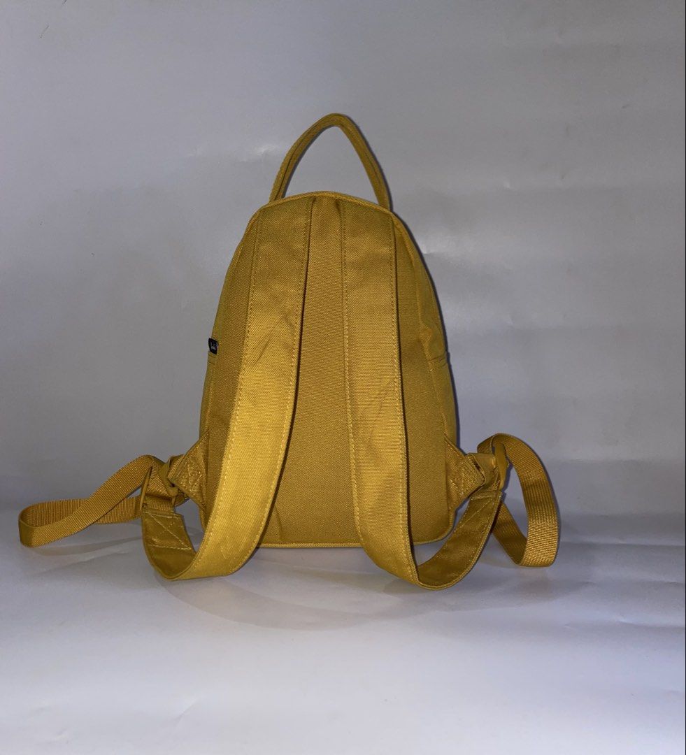 Herschel Nova Mini Backpack ( Mustard Yellow ) (Category: Backpacks) located in Tandag. Submitted by jig_gy (Listing ID 1467012759, Image 2). Description: • Brand: Herschel Supply Co. Spot PH • Model: Nova Mini Backpack (9L capacity) • Color: Harvest Gold / Mustard Yellow • Dimensions: 11” (H) x 8” (W) x 4.75” (D) • • Features: • Signature dual top carrying handles • Exposed metal zippers • Front storage pocket Signature striped fabric liner 1,50