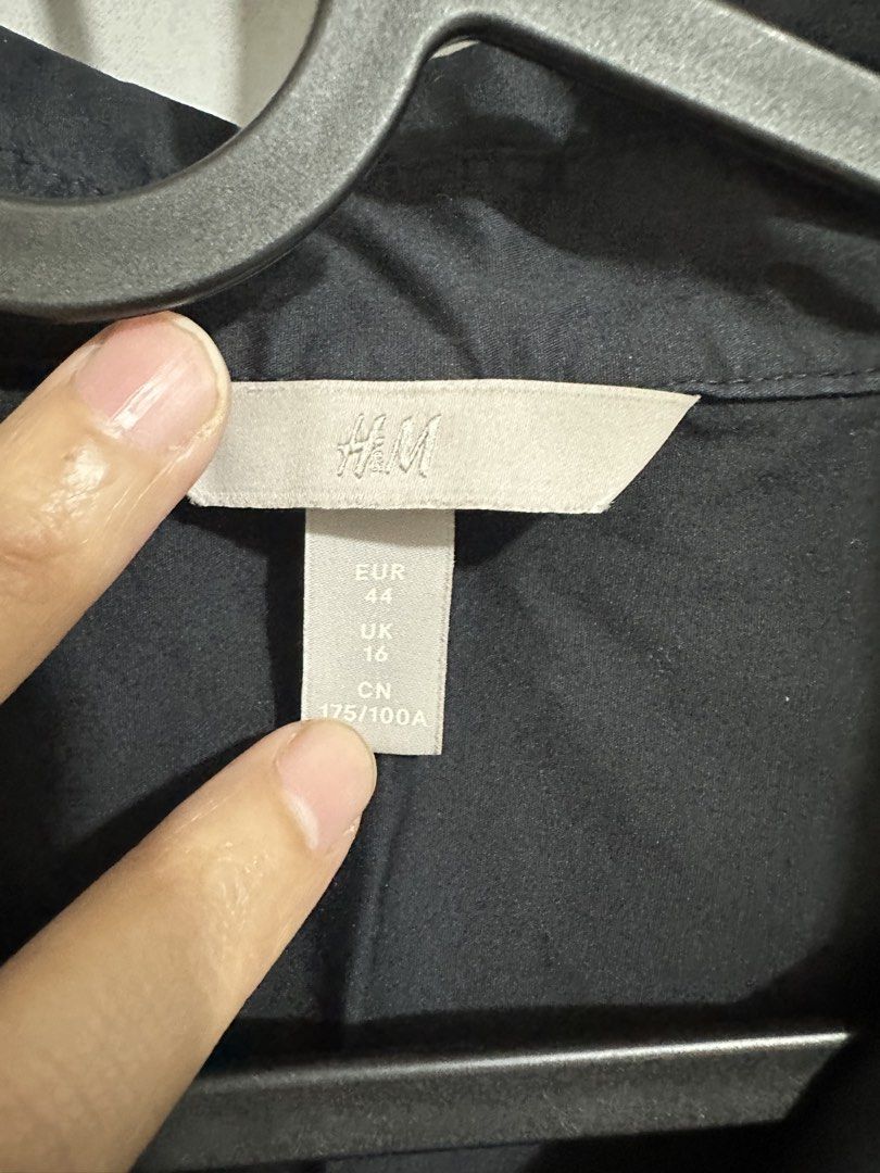 H&M Black Button Polo Long Sleeve Shirt XL (Category: Longsleeves) located in Quezon City. Submitted by mananglinette (Listing ID 1466976149, Image 2). Description: - Brand: H&M - Color: Black - Size: EUR 44 (relaxed fit) - Material: Standard woven cotton feel - Details: Classic collar, front button closure, single chest pocket, buttoned cuffs - Condition: Ready to wear - Style: Classic basic piece for everyday outfits.
