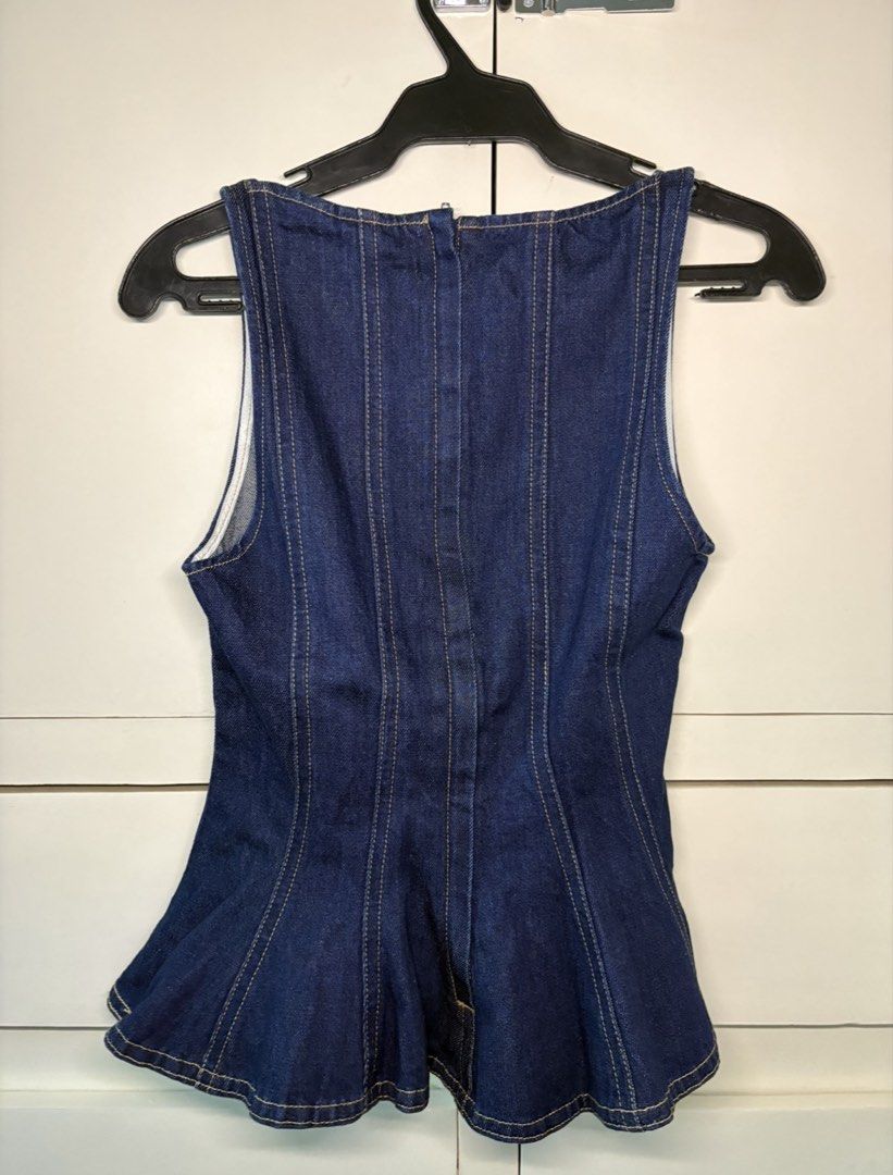 H&M Dark Denim Peplum Top (Category: Sleeveless) located in Paranaque City. Submitted by honeykkkk (Listing ID 1467076891, Image 2). Description: • Details: Structured dark wash denim top featuring panel seam detailing for a corseted fit, classic square neckline, back zip closure, and a flared peplum hem. • Condition: Brand new condition — never worn. • Size: Fits XS to S.