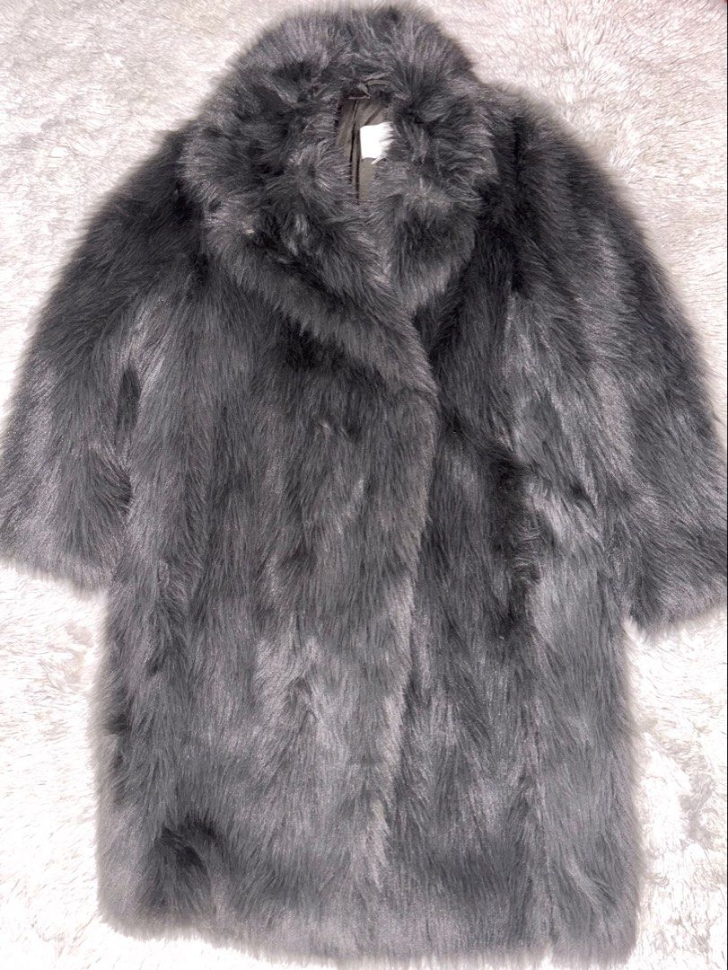 H&M Gray Long Fur Winter Coat (Category: Coats, Jackets and Outerwear) located in Bulacan. Submitted by rin2024 (Listing ID 1467050884, Image 1). Description: H&M Gray Long Fur Winter Coat - With 3 secure buttons to keep shape when worn - With collar and long sleeves - With thick and heavy fabric - Also bought from Carousell Payment Option: GCash only. Shipping Methods: Grab, Lalamove, or J&T only, with shipping shouldered by buyer..