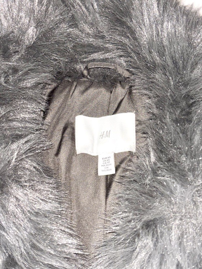 H&M Gray Long Fur Winter Coat (Category: Coats, Jackets and Outerwear) located in Bulacan. Submitted by rin2024 (Listing ID 1467050884, Image 3). Description: H&M Gray Long Fur Winter Coat - With 3 secure buttons to keep shape when worn - With collar and long sleeves - With thick and heavy fabric - Also bought from Carousell Payment Option: GCash only. Shipping Methods: Grab, Lalamove, or J&T only, with shipping shouldered by buyer..
