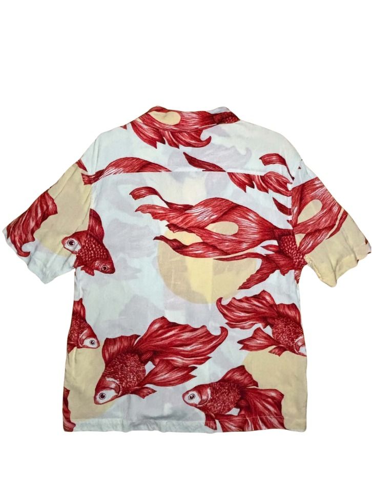 H&M Hawaiian Red Betta fish Button down Polo Shirt (Category: Tshirts & Polo Shirts ) located in Marikina City. Submitted by maobuysstuff (Listing ID 1467013408, Image 2). Description: H&M Hawaiian Red Betta fish Button down Polo Shirt - Style: Short sleeve button-down shirt - Design: White background with vibrant red betta fish print and soft yellow circles - Lightweight fabric ideal for warm weather - 20" x 26" (front), 28" (back).