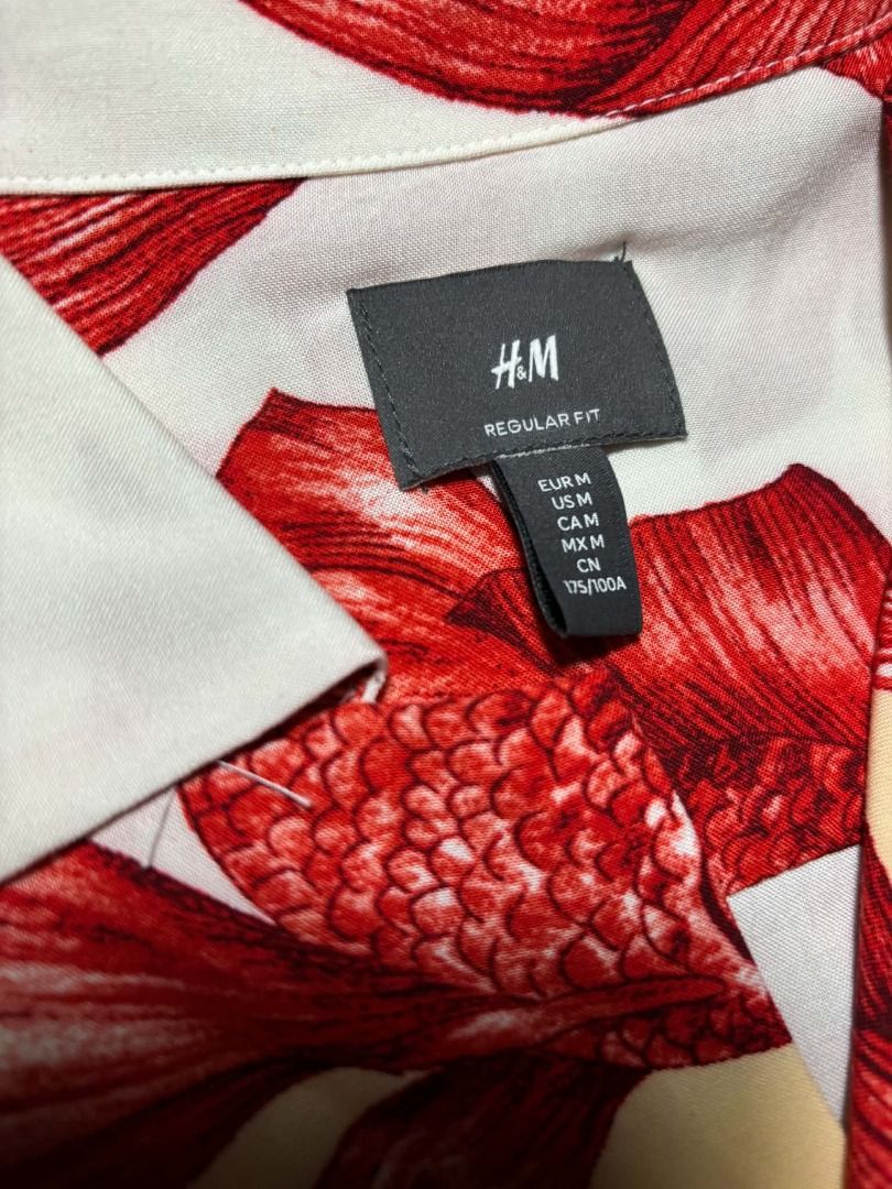 H&M Hawaiian Red Betta fish Button down Polo Shirt (Category: Tshirts & Polo Shirts ) located in Marikina City. Submitted by maobuysstuff (Listing ID 1467013408, Image 3). Description: H&M Hawaiian Red Betta fish Button down Polo Shirt - Style: Short sleeve button-down shirt - Design: White background with vibrant red betta fish print and soft yellow circles - Lightweight fabric ideal for warm weather - 20" x 26" (front), 28" (back).