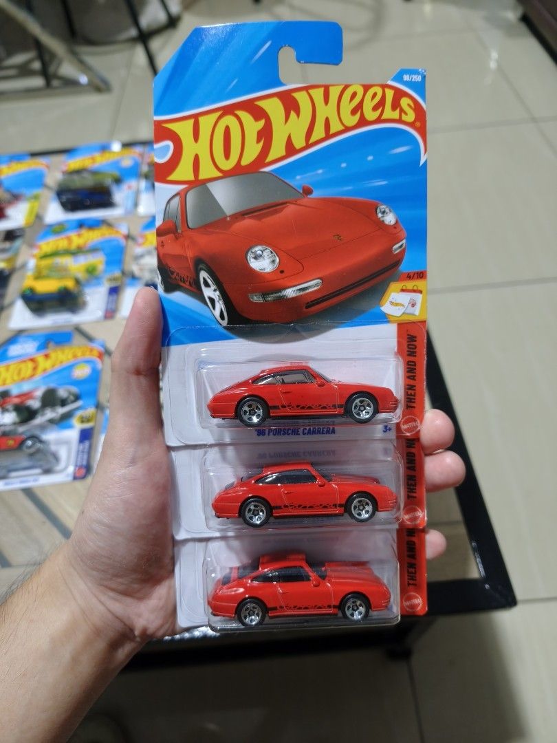 Hot Wheels 96 Porsche Carrera Red (Category: Vehicle & Diecast Models) located in Manila. Submitted by paul.c29cruz (Listing ID 1467104304, Image 1). Description: - Item: Hot Wheels '96 Porsche Carrera - Series: Then and Now (4/10) - Color/Design: Bright red finish with sleek black side graphics - Perfect for: Porsche enthusiasts and mainline diecast collectors 169 Each Madami pa kong ibang hotwheels. Check mo nalang. Hard to find, mahal pa sa ib
