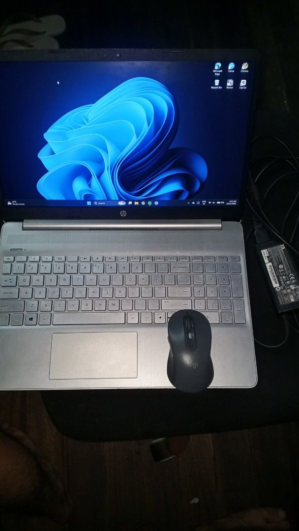 HP Silver Laptop with Charger and Logitech Mouse (Category: Laptops & Notebooks) located in Manila. Submitted by mikooo03 (Listing ID 1467163753, Image 1). Description: - Model: Silver HP Laptop running Windows 11 - Condition: Clean screen and body, well-maintained - Keyboard: Full layout complete with a number pad - Battery & Power: Battery holds a good charge; original power adapter included - Freebie Bundle: Comes with a sleek black Logitech w