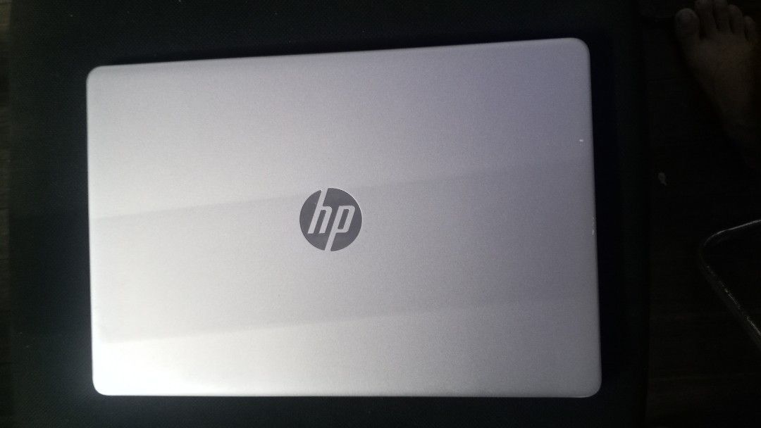 HP Silver Laptop with Charger and Logitech Mouse (Category: Laptops & Notebooks) located in Manila. Submitted by mikooo03 (Listing ID 1467163753, Image 3). Description: - Model: Silver HP Laptop running Windows 11 - Condition: Clean screen and body, well-maintained - Keyboard: Full layout complete with a number pad - Battery & Power: Battery holds a good charge; original power adapter included - Freebie Bundle: Comes with a sleek black Logitech w