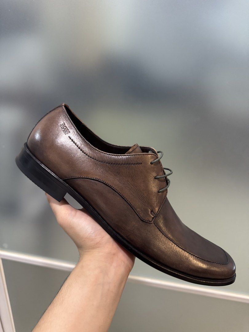 Hugo BOSS Leather Shoes (Category: Dress Shoes) located in Quezon City. Submitted by thewarmup.mnl (Listing ID 1467110943, Image 1). Description: - Original - Brand New - Size: US13 - Negotiable .